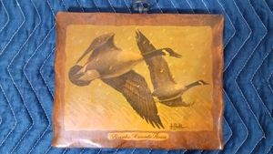 Les Kouba goose and Joseph Wolf plaques