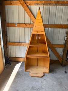 handcrafted wooden canoe bookshelf