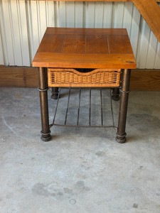 end table with metal frame and wicker drawer