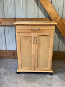 solid wood rolling kitchen cart with contents inside