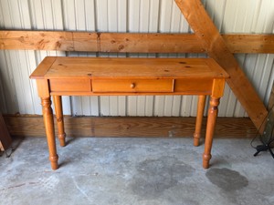 knotty pine console table (often styled as a sofa or entryway table