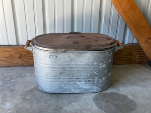 antique galvanized metal boiler tub with a lid and wooden handles