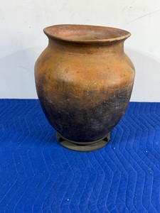 vintage or antique burnished terracotta storage vessel, traditionally handcrafted and used for cooking, fermentation, or storing dry goods