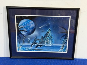 Framed picture with dolphins, ship and ocean