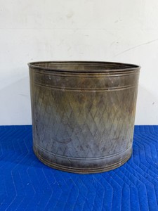 vintage brass floor planter bucket featuring a decorative diamond-patterned relief and a naturally aged patina