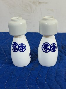 traditional Sho Chiku Bai porcelain sake bottle (known as a tokkuri), typically paired with matching ochoko (sake cups)
