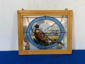 stained glass panel featuring a ring-necked pheasant is a hand-crafted decorative piece framed in light wood