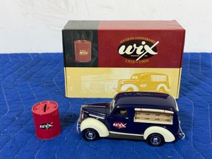 125 Scale 1939 Chevrolet Canopy Panel Truck bank alongside a replica era-appropriate red oil filter bank with Original Box