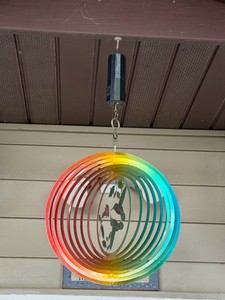 Aoedelyart 12-inch wind spinner features a rainbow-colored, spiral design with a hummingbird motif.