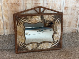 Rustic mirror features a frame constructed from natural birch bark and decorative twigs.