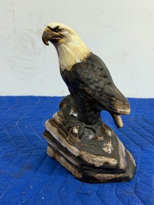 vintage ceramic bald eagle figurine perching on a rock pedestal