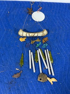 Wind Chime with cano, bears, fish, cabin and more on it