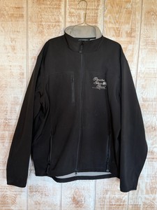 Black Port Authority soft shell jacket features custom embroidery on the chest (Paradise Shores Resort Brainerd Minnesota) - Size XL - Does have some marks on the front