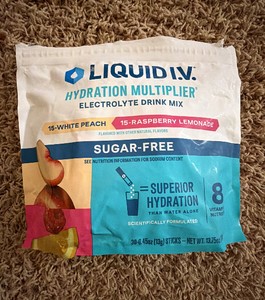 Liquid IV Hydration Mutiplier Mix, White Peach and Raspberry Lemonade flavors, Package Says 30 Packets, but there are 22 Packets Included, Open Main Container But Raining Packets are Unopened and Product Doesnt Expire until 2028