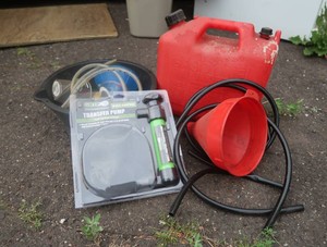 GAS CAN, 2 FUNNELS, TUBING, TRANSFER PUMP, AND MORE