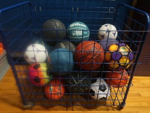 BLUE METAL ROLLING CART FULL OF SPORT BALLS