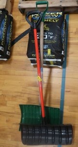 2 SNOW SHOVELS AND 2 50LB BAGS OF POWER THAW SALT