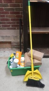 TOTE FILLED WITH NEW PAPER NAPKINS, BROOMDUST, AND MISC CLEANING SUPPLIES