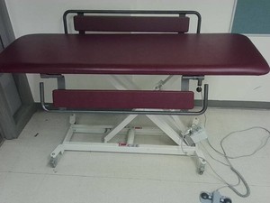 ADJUSTABLE TREATMENT TABLE