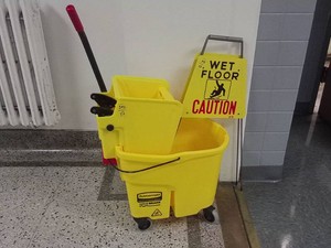 RUBBERMAID MOP BUCKET WITH CAUTION SIGN