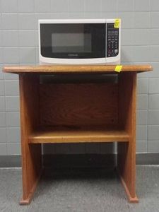 MICROWAVE AND SMALL WOODEN TABLE