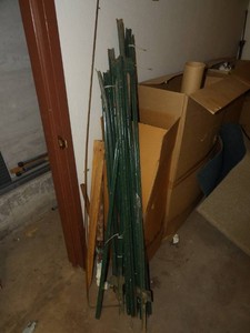 ASSORTED GREEN FENCE POSTS AND COPPER PIPE
