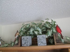 Large faux foliage, bird themed boo...