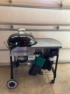 Weber Charcol Grill with Propane lighting assist.