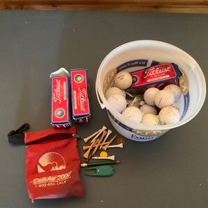 Bucket of golf balls and tees