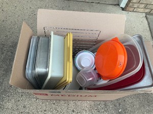Assortment of kitchen cake pans and storage containers
