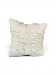 Cream colored throw pillow