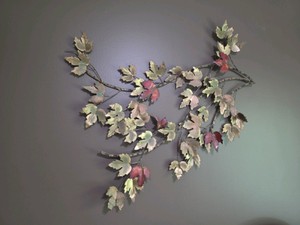 Metal Wall Art that measures 36" wide / 32" tall