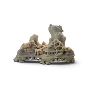 Hand-carved Chinese soapstone mountainscape sculpture featuring a village and temples.