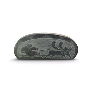 Vintage Russian Inuit soapstone paperweight featuring etched sgraffito art