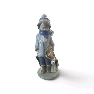 Lladr porcelain figurine named Winter Boy with Dog, model number 5220, featuring a matte and gloss finish.