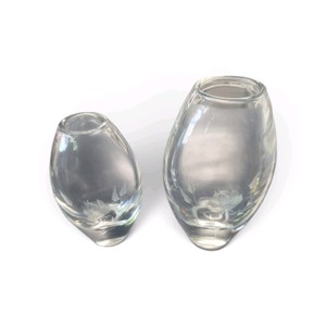 Vintage Orrefors bud vases made of thick, clear glass.