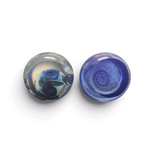 2 Glass Eye Studio paperweight from the Celestial Series, specifically the Andromeda