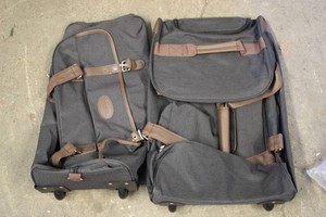2 Travel Duffel Bags With Rollers...