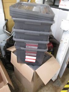 8 Plastic totes with lids, all have...