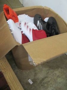 Box of new sports cleat shows witho...
