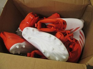 Box of new sports cleat shows witho...