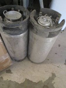 Pair of metal liquid canisters...