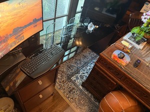 A Desk Created by Two File Cabinets and a Thick Glass Topper (Desk only. Does not included items on desk.)