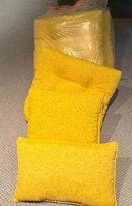 Four Yellow Outdoor Cushions Appear Gently Used to Unused (18 x 18)