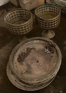 Planters Two Metal Pedestal Planters and one Round Cement Pot Saucer and Plastic Pot Saucer
