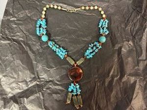 Handcrafted Artisan Necklace Featuring Turquoise Nugget Chips and a Large Central Red Stone
