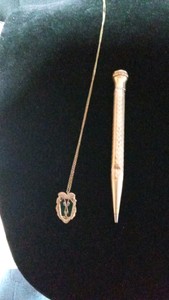 Vintage lion shield medallion necklace with green stone on a 120 10K GF chain and a Whal Ever Sharp gold filled pen