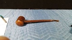 a resemblance of an artisan- made churchwarden tobacco pipe with a long, slender stem designed for cool smoke with