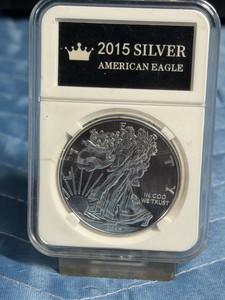 2015 American Silver Eagle coin sealed inside a clear acrylic protective holder
