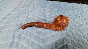 Dragon claw tobacco pipe, often handmade from rosewood or similar solid wood